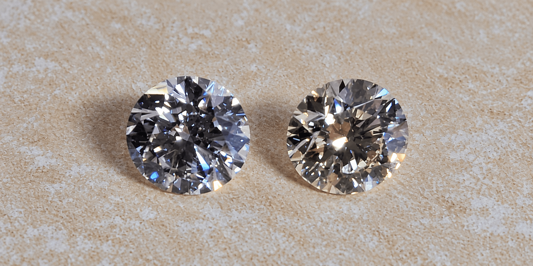 Two natural round brilliant diamonds showing different colour, brightness and visual character